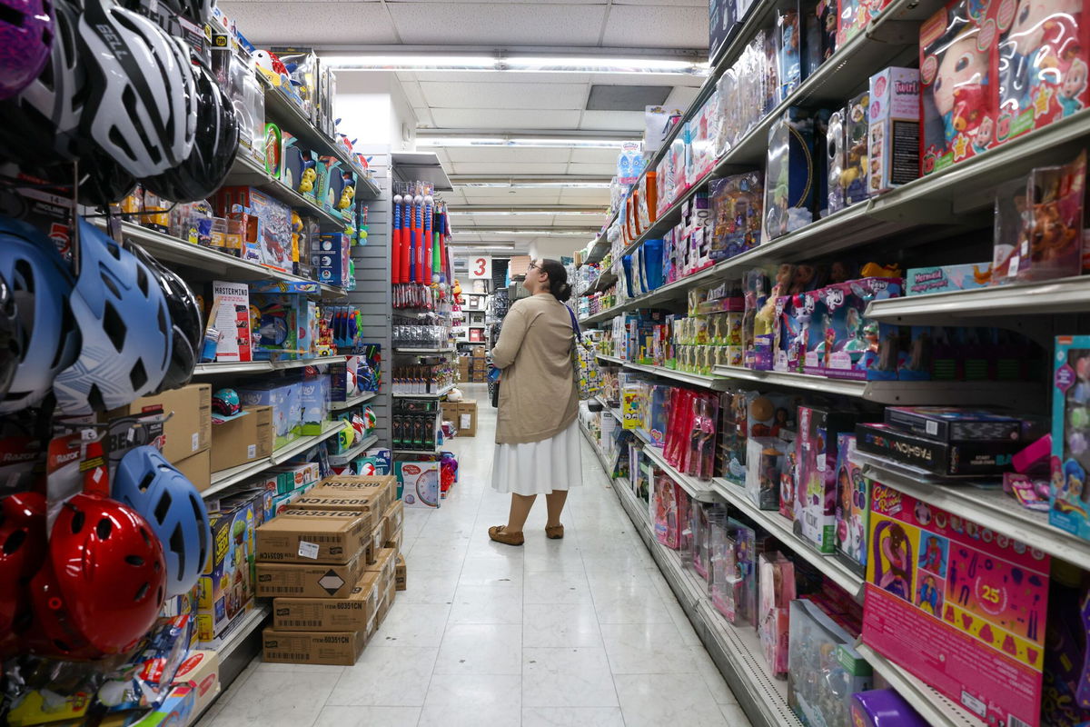 <i>Spencer Platt/Getty Images via CNN Newsource</i><br/>People shop at a Manhattan retail store on July 15