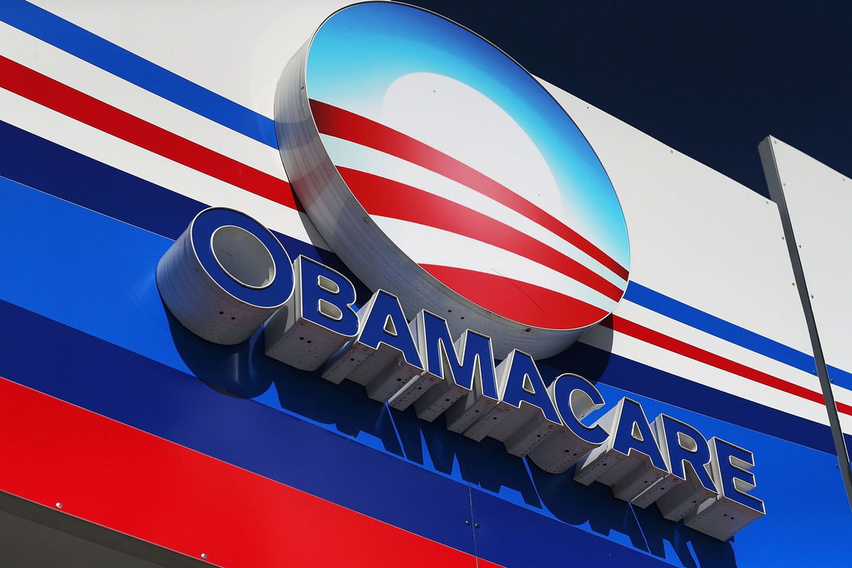 <i>Joe Raedle/Getty Images via CNN Newsource</i><br/>An Obamacare sign is seen on the UniVista Insurance company office on December 15