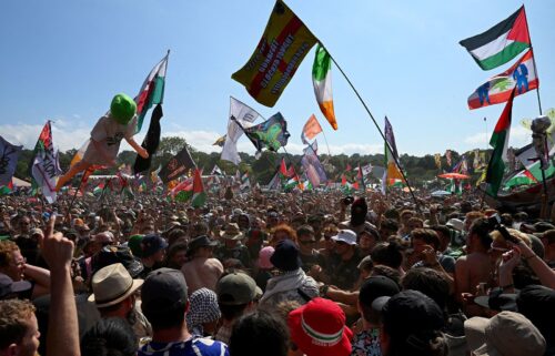 Revellers gather as Kneecap performs at Glastonbury Festival at Worthy Farm in Pilton