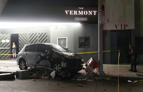 Police patrol vehicles close Vermont Ave. after a vehicle rammed into a crowd gathered outside "The Vermont" nightclub in Los Angeles