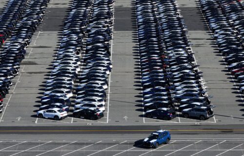 Brand new Subaru cars sit in a storage lot on March 24