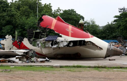 Wreckage of the Air India Boeing 787-8 Dreamliner plane sits on the open ground