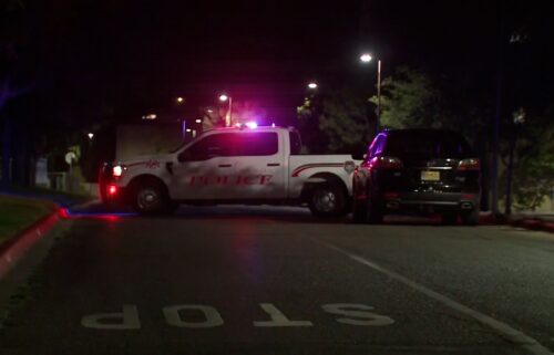 Police are seen at the scene of a shooting at The University of New Mexico on July 25 in Albuquerque.