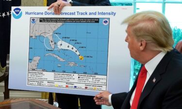 President Donald Trump references a map of a forecast for Hurricane Dorian in 2019. Trump drew on the map with a Sharpie to indicate the storm would track over Alabama. It did not.