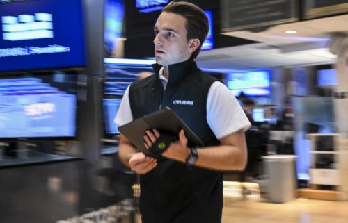 A trader works on the floor of the New York Stock Exchange (NYSE) at the opening bell on July 15.