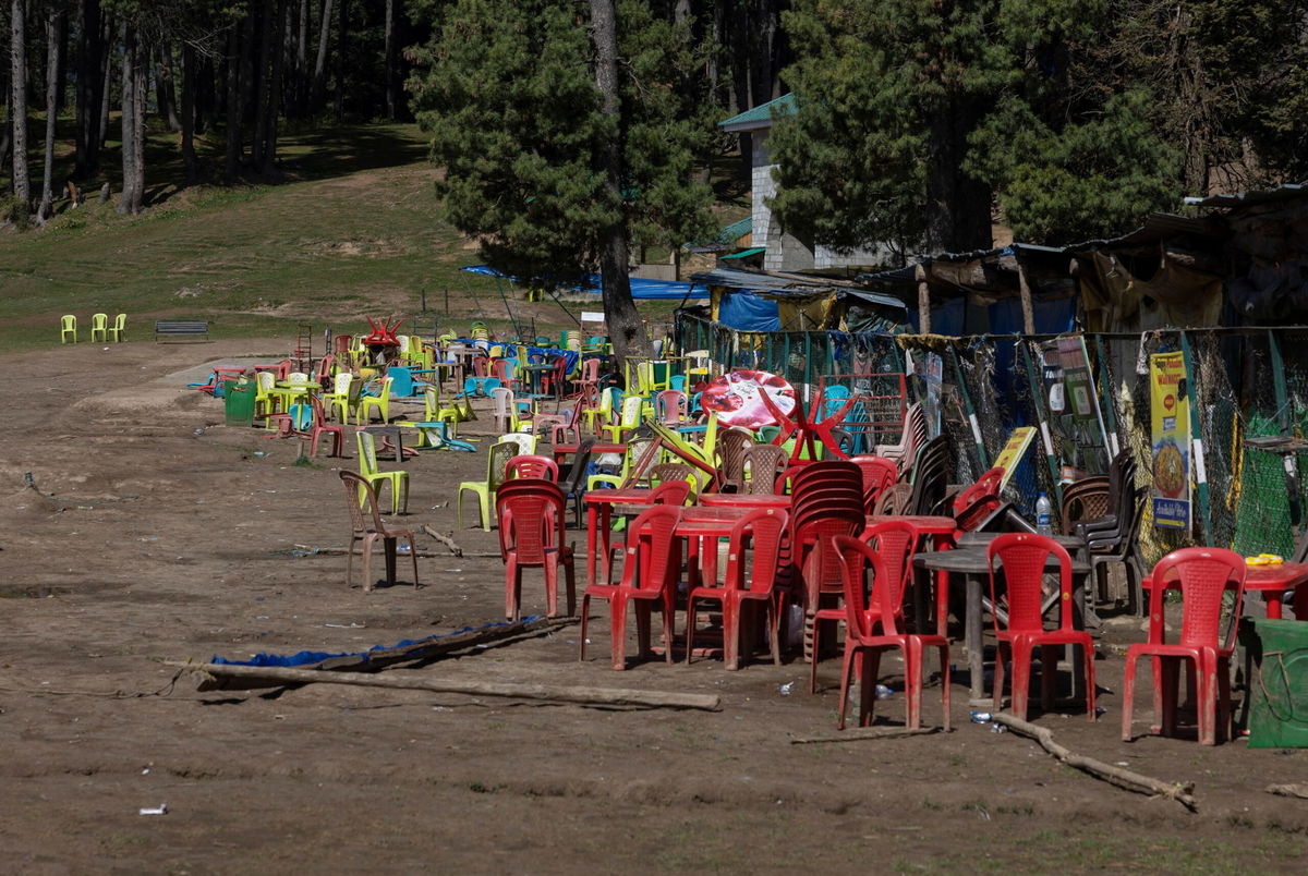 <i>Adnan Abidi/Reuters via CNN Newsource</i><br/>Chairs and tables are scattered at the site of the militant attack on tourists in Baisaran near Pahalgam in south Kashmir's Anantnag district