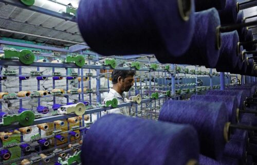 An employee works inside a textile mill at Bhilwara in India's Rajasthan state. President Donald Trump on July 29 threatened to raise tariffs on Indian imports as high as 25%.