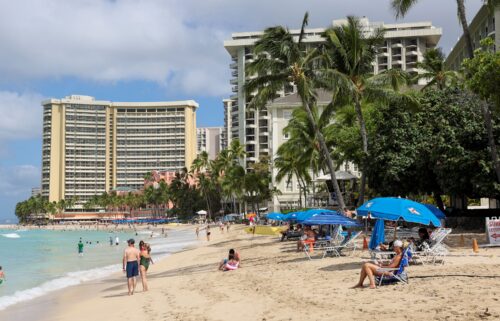 Beachgoers gather in Waikiki after authorities downgraded earlier tsunami warnings following an earthquake off Russia’s Kamchatka Peninsula.