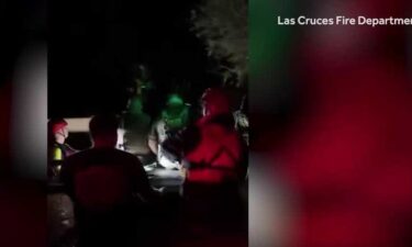 A floodwater rescue response led to firefighters getting swept down the Rio Grande in southern New Mexico.
