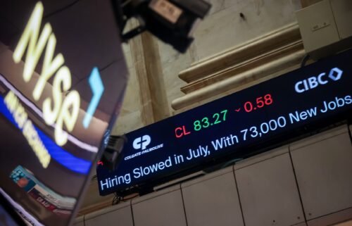 A news ticker broadcasts jobs report news on the floor of the New York Stock Exchange in New York