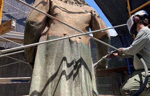 Micro-abrasive cleaning of the Albert Pike statue to remove corrosion and paint in order to review the conditions of the bronze prior to repairs