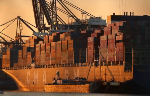 A cargo ship is unloaded at Port Liberty in New Jersey. President Donald Trump's tariffs have brought in record levels of revenue.