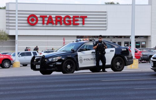 Police block the entrance to a Target after a shooting in Austin