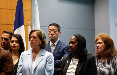 Texas House Democratic Caucus Chair Rep. Gene Wu stands next to Democratic members of Congress and Texas House Democrats during a news conference on August 4 in Warrenville