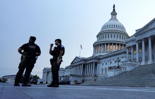 Police officers stand guard in front of the US Capitol in Washington