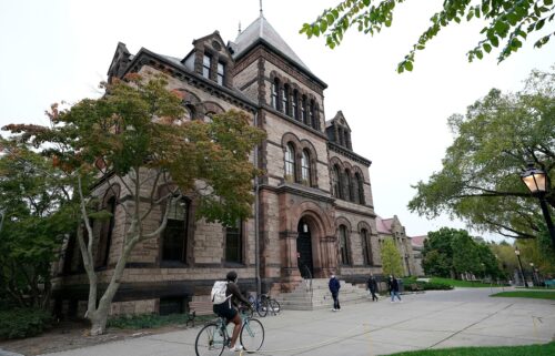 People traverse Brown University campus in Providence