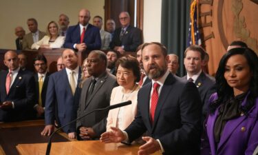Lawmakers and elected officials speak after a House meeting at the state Capitol on August 5.