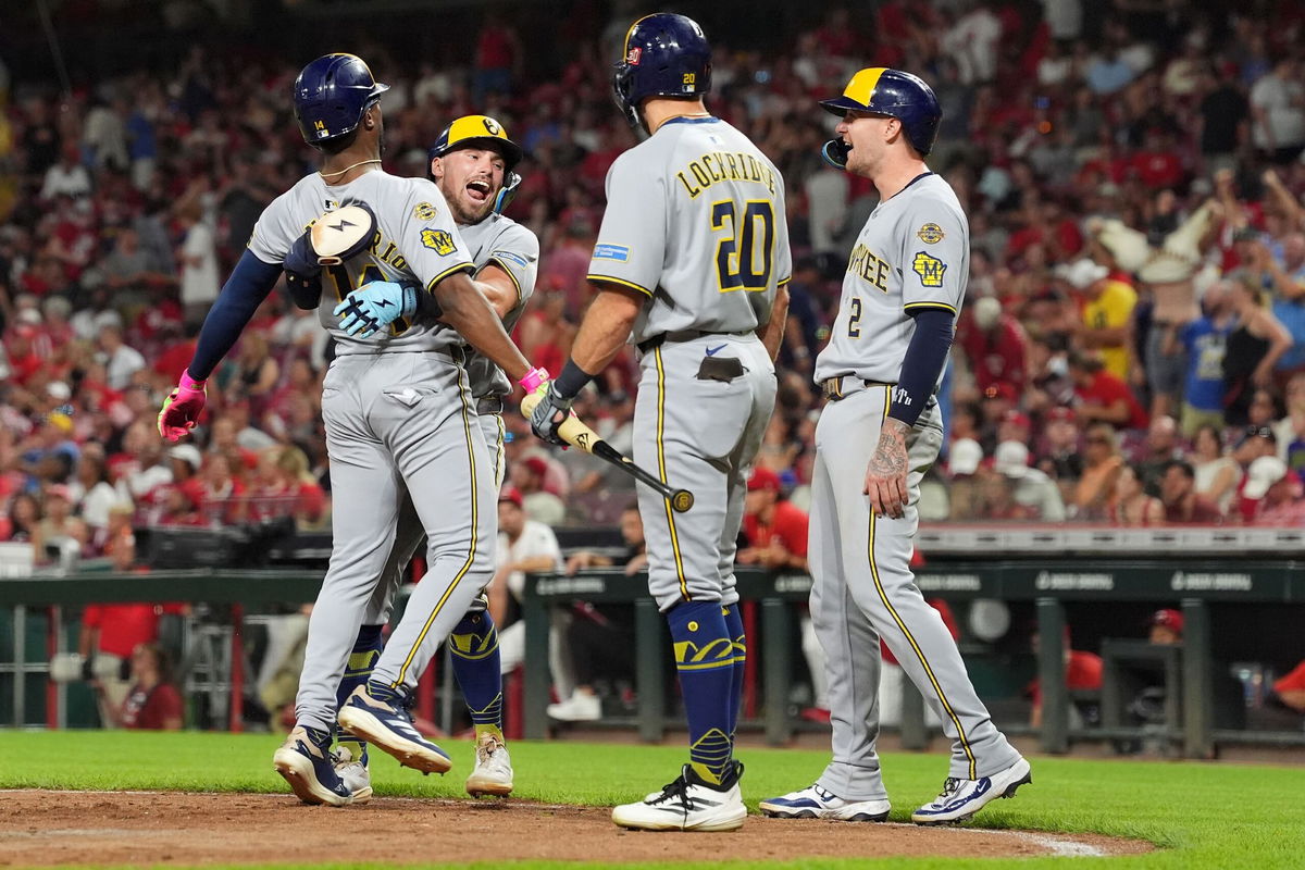 <i>Katie Stratman/Imagn Images/Reuters via CNN Newsource</i><br/>Milwaukee Brewers third baseman Caleb Durbin hits a double in the seventh inning against the Cincinnati Reds on August 16.