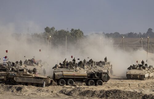 Israeli troops are seen near the border with Gaza on August 6.