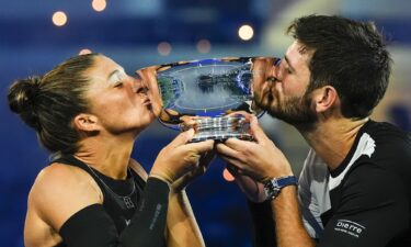 Errani and Vavassori celebrate winning match point in their mixed doubles semifinal.