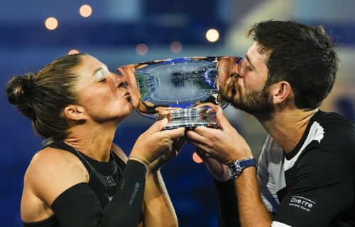 Errani and Vavassori celebrate winning match point in their mixed doubles semifinal.