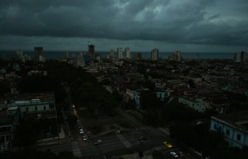 People charge cell phones during a nationwide blackout in Havana in March.