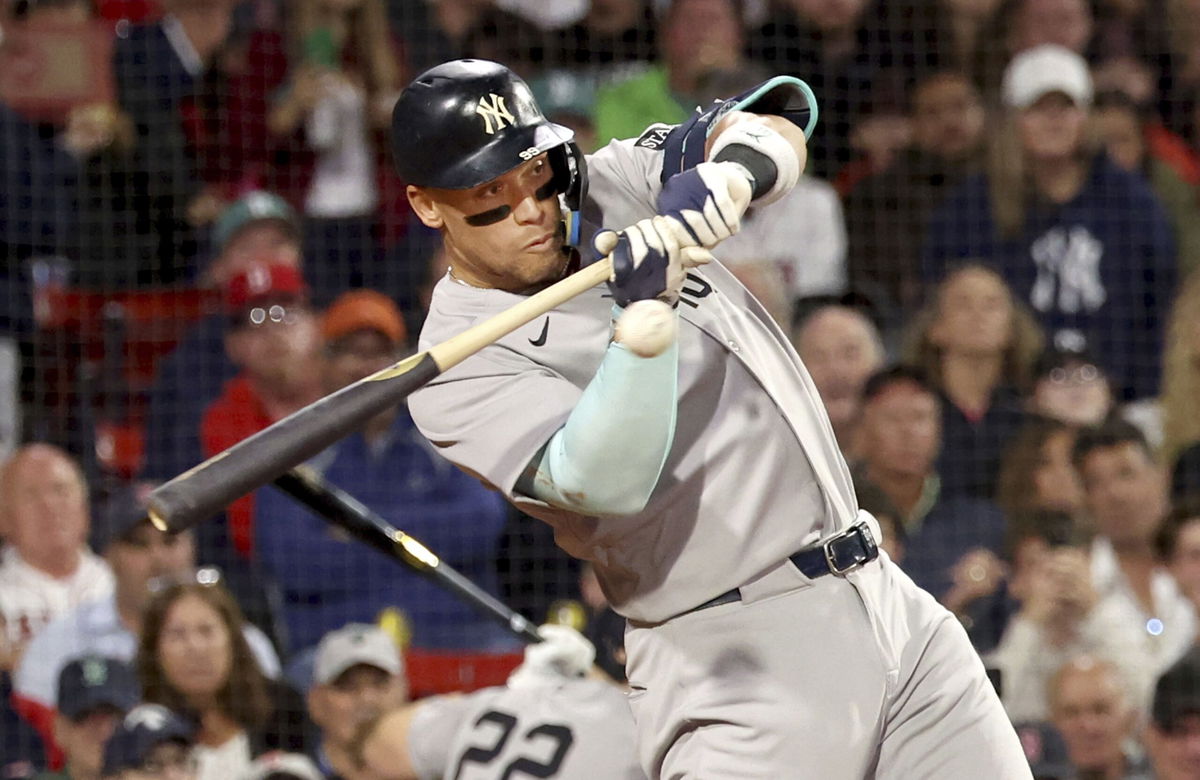<i>Mark Stockwell/AP via CNN Newsource</i><br/>Aaron Judge swings at a strike during the fifth inning of Friday night's win over the Boston Red Sox.