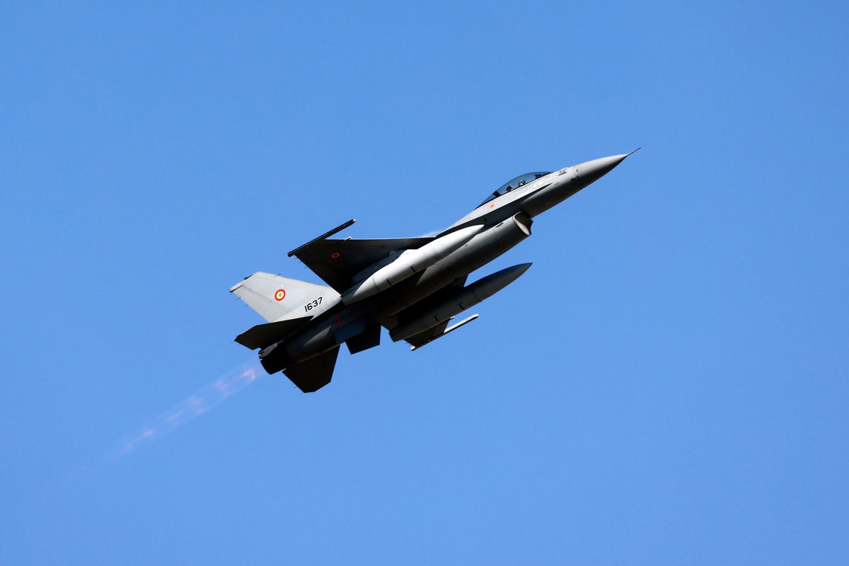 <i>Christian Criste/Getty Images via CNN Newsource</i><br/>A Romanian Air Force military pilot performs on an F-16 Fighting Falcon jet during the Bucharest International Air Show 2025 BIAS in Romania on August 30.