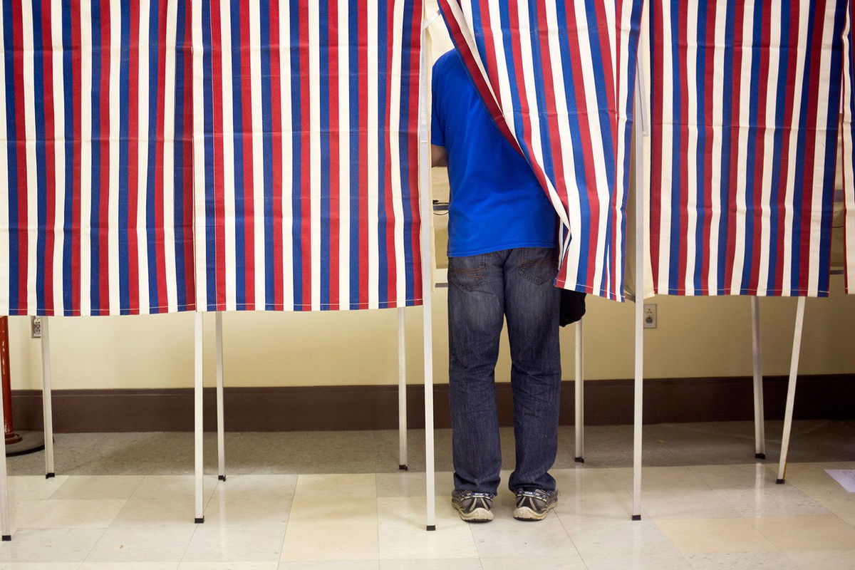 <i>Brianna Soukup/Portland Portland Press Herald/Getty Images/File via CNN Newsource</i><br/>A voter fills out their ballot in the voting booths at Merrill Auditorium in Portland