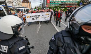 A protester makes the fascist salute during a march organized by the far-right organization Falange Espanola