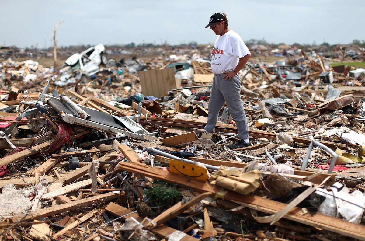 <i>Tom Pennington/Getty Images via CNN Newsource</i><br/>Homeowner Russell Shearer looks over the rubble of his destroyed home in May 2013 in Moore