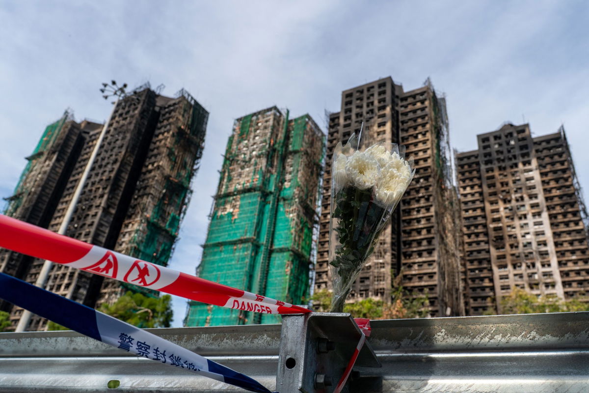 A bouquet of flowers at the scene where a major fire engulfed several residential buildings at Wang Fuk Court on November 28