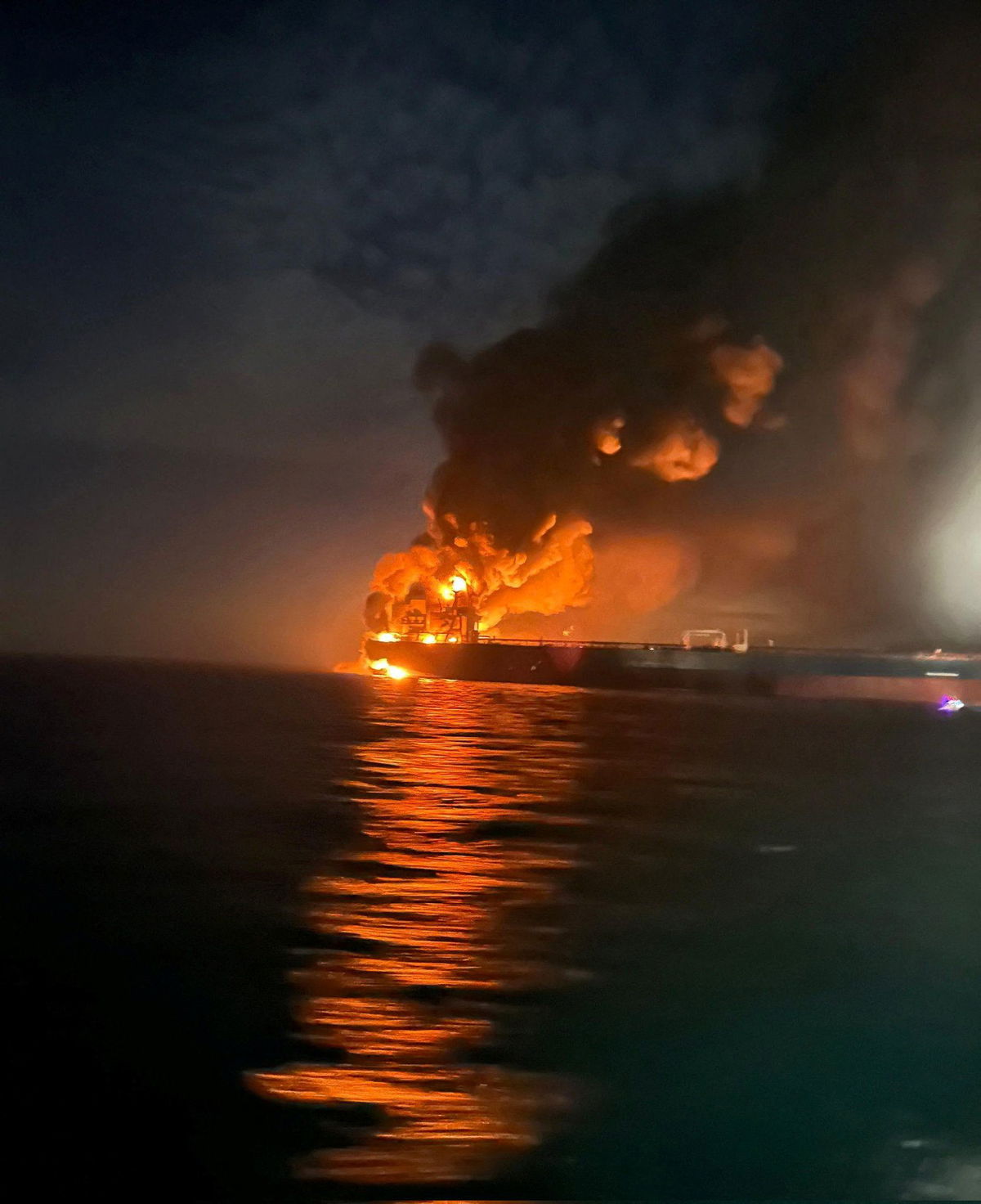 Flames and thick smoke rise from a tanker after blasts struck two vessels from Russia’s shadow fleet in the Black Sea