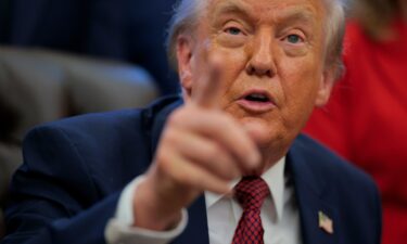 President Donald Trump takes questions from the press in the Oval Office on Wednesday.